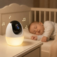 Babyphone veilleuse posé près du lit de bébé, veilleuse allumée